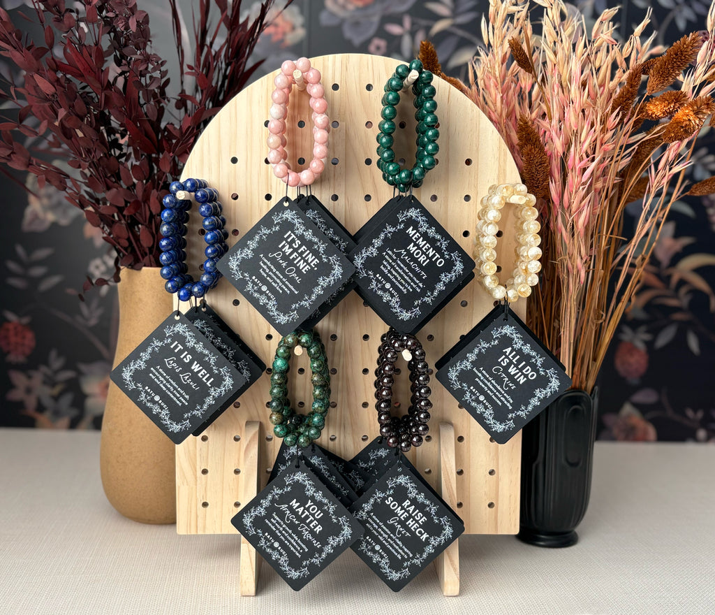 An assortment of luxurious gemstone bracelets, lapis lazuli, pink opal, malachite, citrine, African turquoise, garnet. All handmade in Colorado, USA.