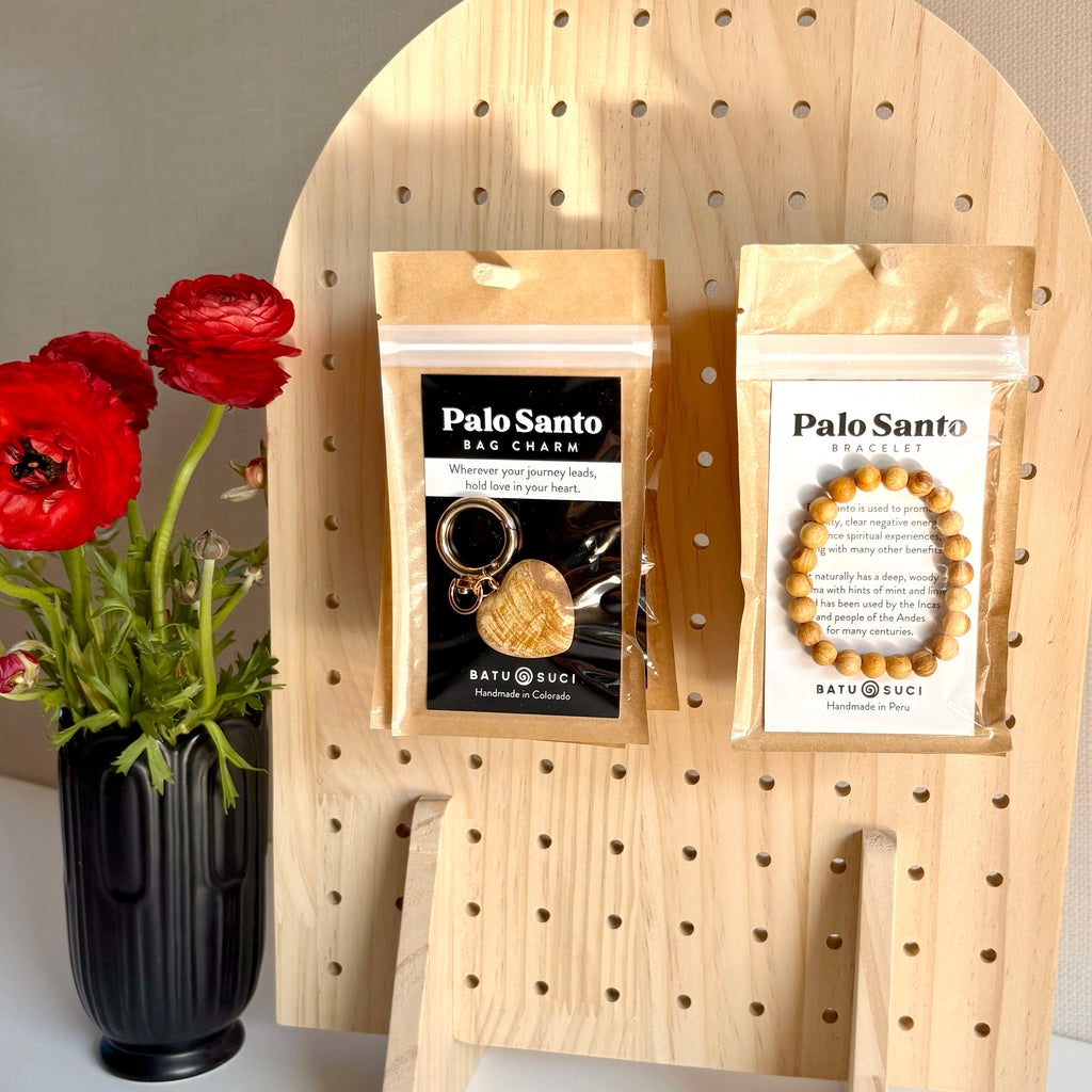 Hand-carved Palo Santo Heart Bag Charm on gold-plated swivel clip keychain, sustainably sourced from Peru. Palo Santo "Holy Wood" Bracelet.
